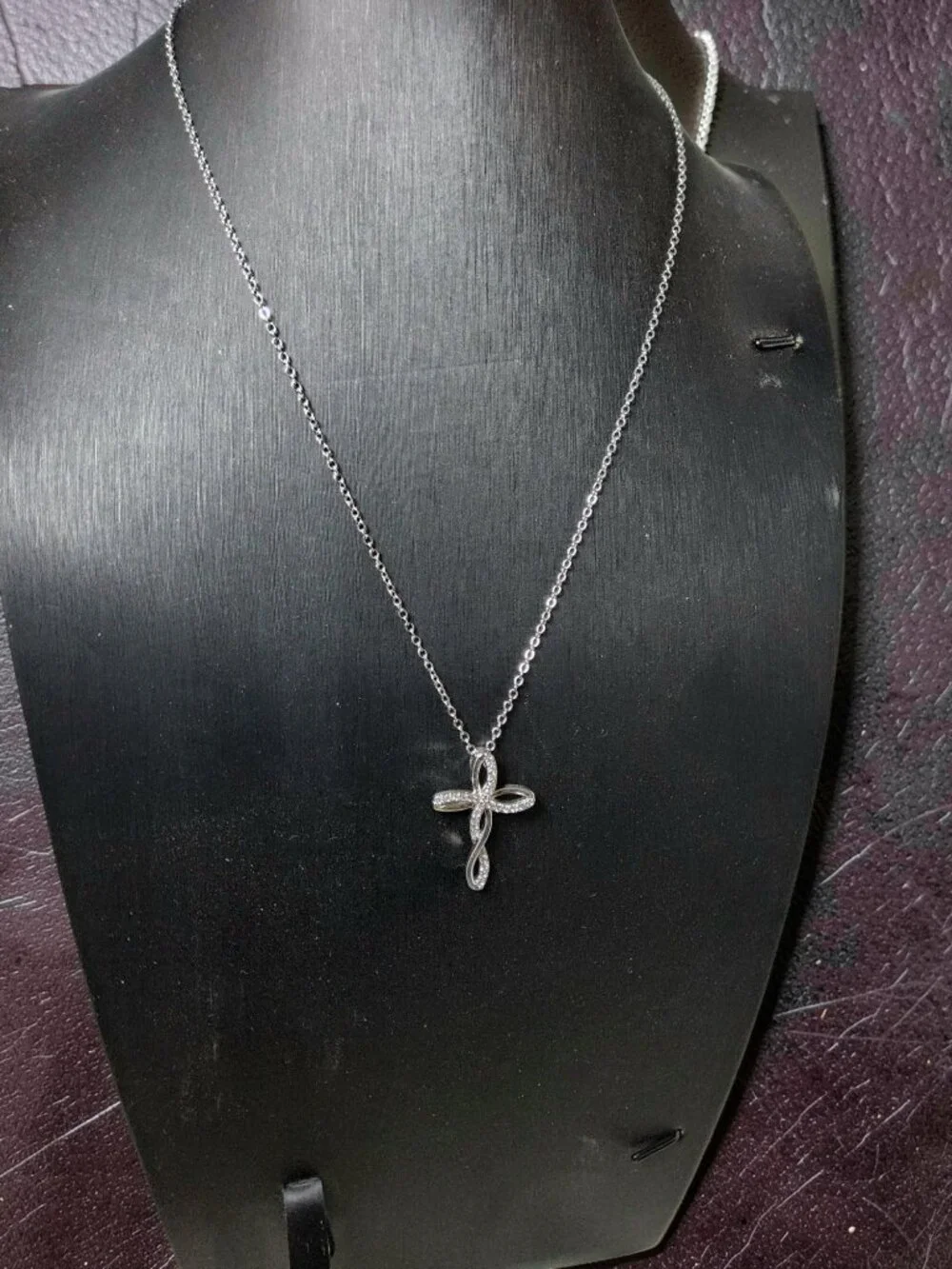 vintage Chrystal lined spiraled curled cross on a .925 sterling necklace